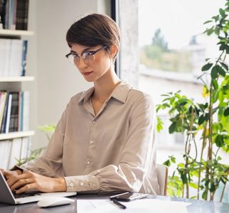 young-woman-working-on-laptop-2022-02-02-04-50-04-utc@2x